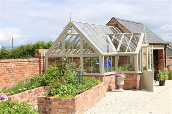 Can greenhouse have brick walls?