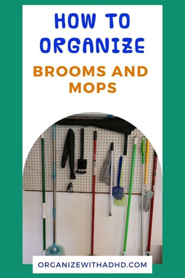 How do I organize my mops and brooms?